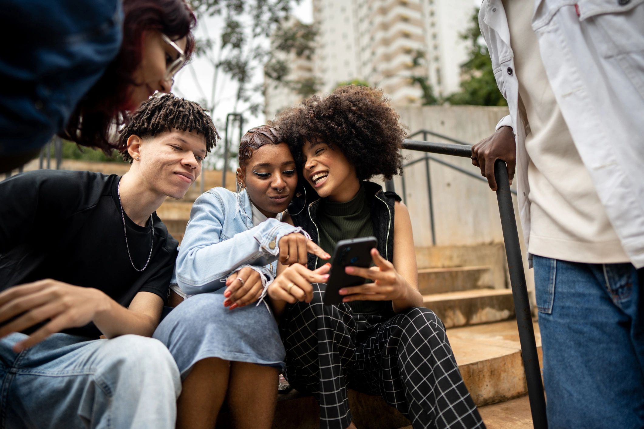 Friends watching and sharing videos on a phone