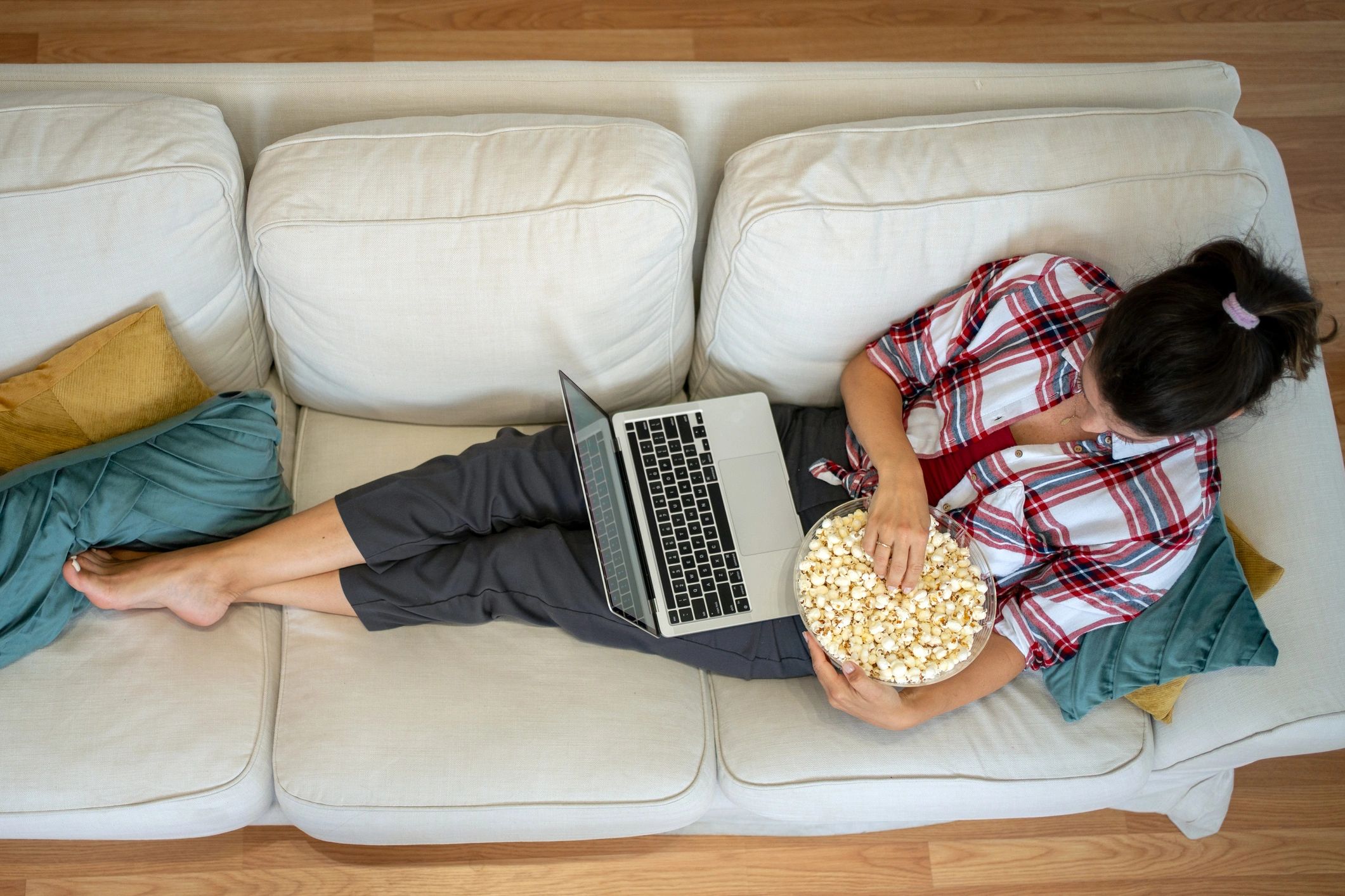 Person watching a video on a laptop at home