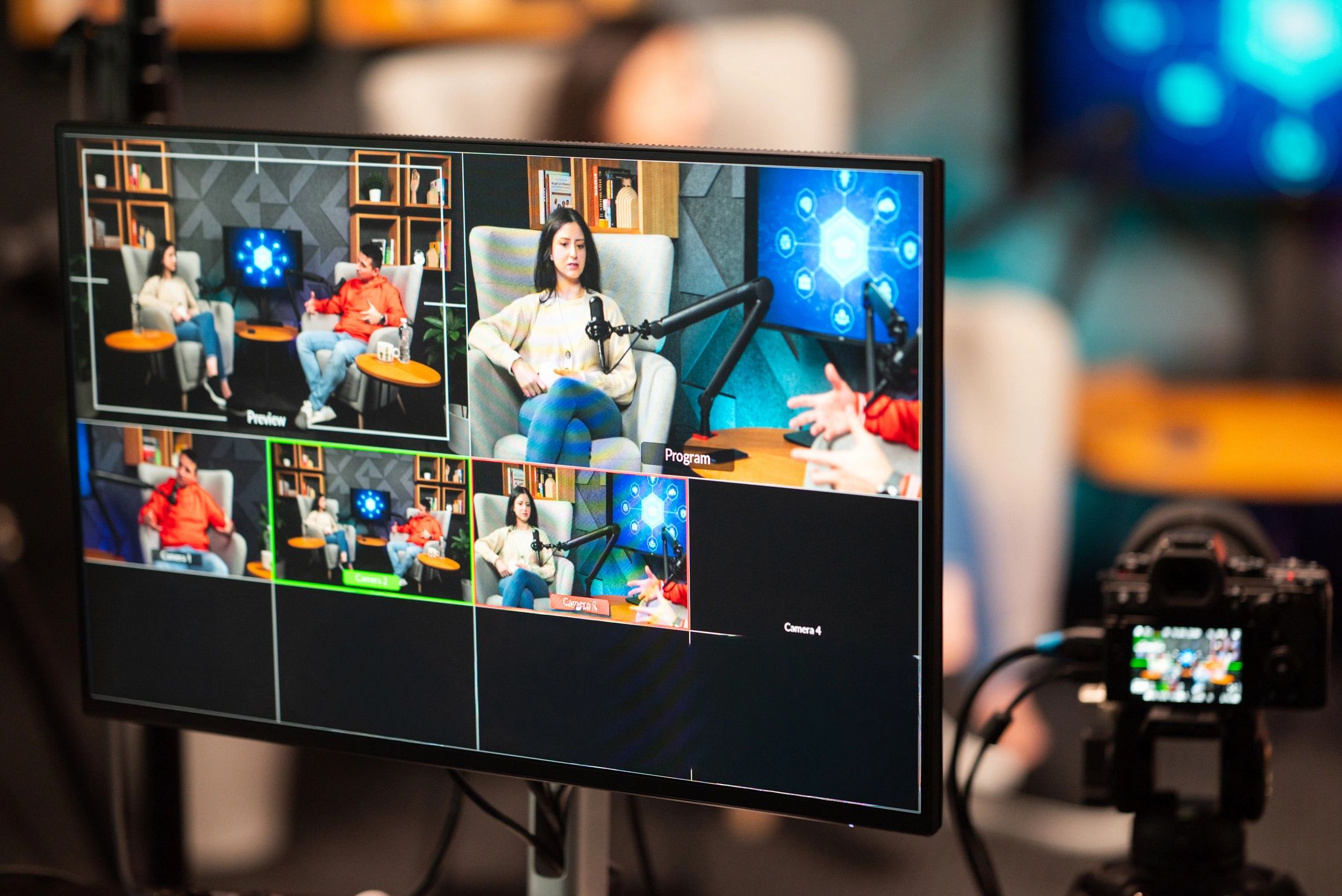 Podcast studio setup with cameras, monitors, and lights
