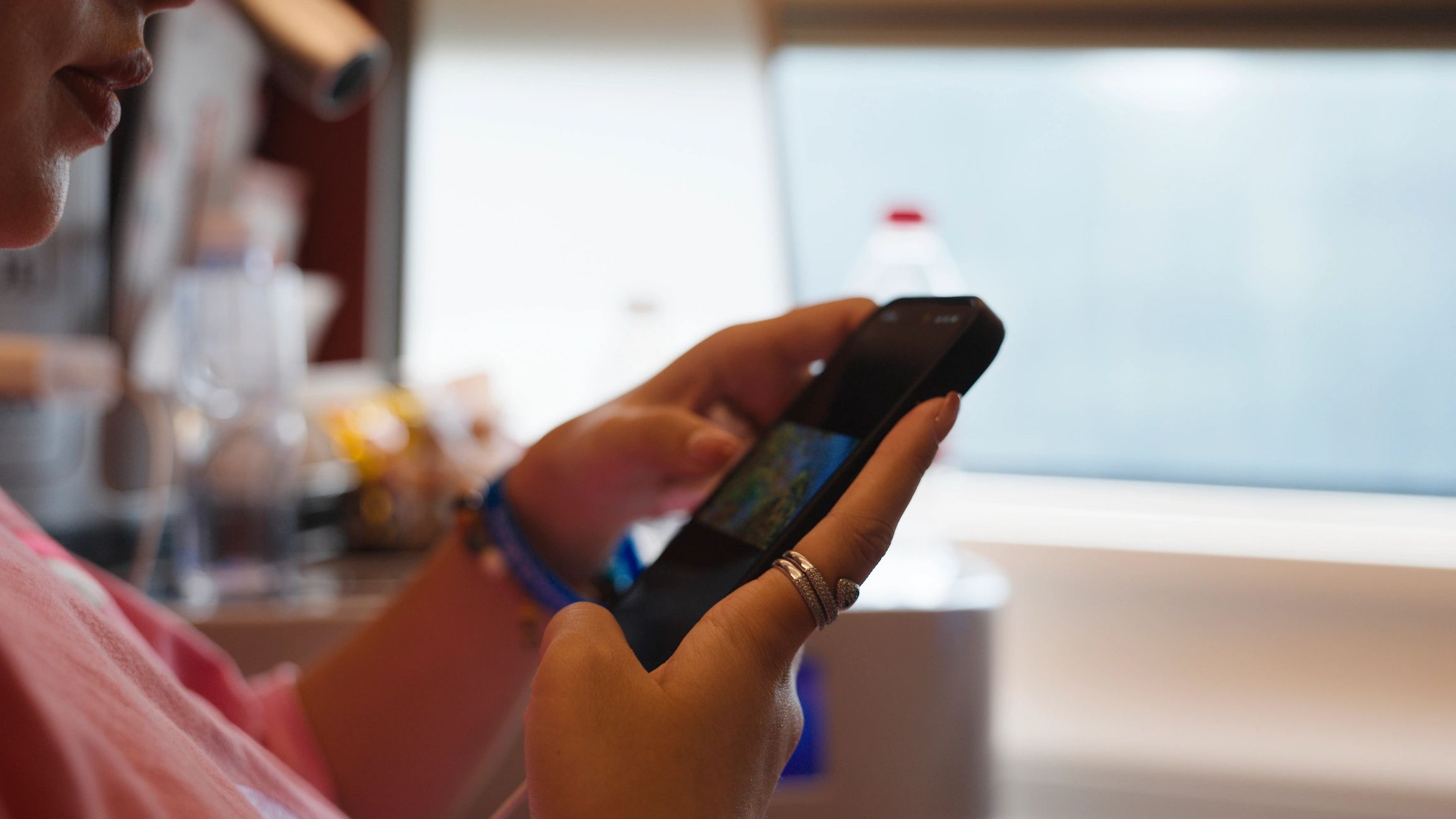Woman using a smartphone on a train
